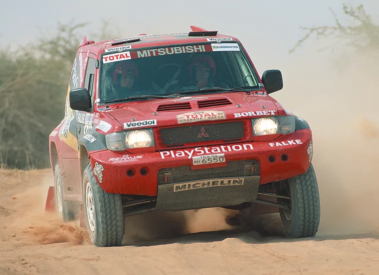 1999 Mitsubishi Pajero Dakar rally car in action