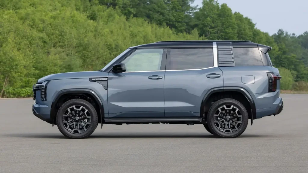 New Mitsubishi Pajero in grey, side view on tarmac