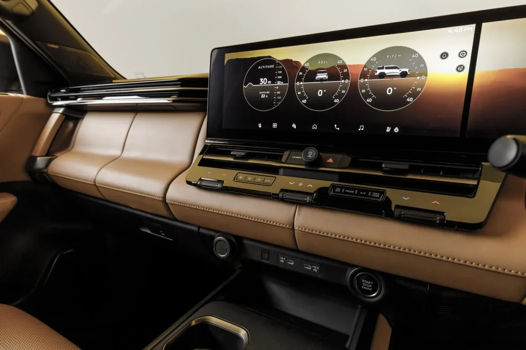New Mitsubishi Pajero dashboard with the digital Multi Meter showing altitude, roll and pitch gauges beside the touchscreen