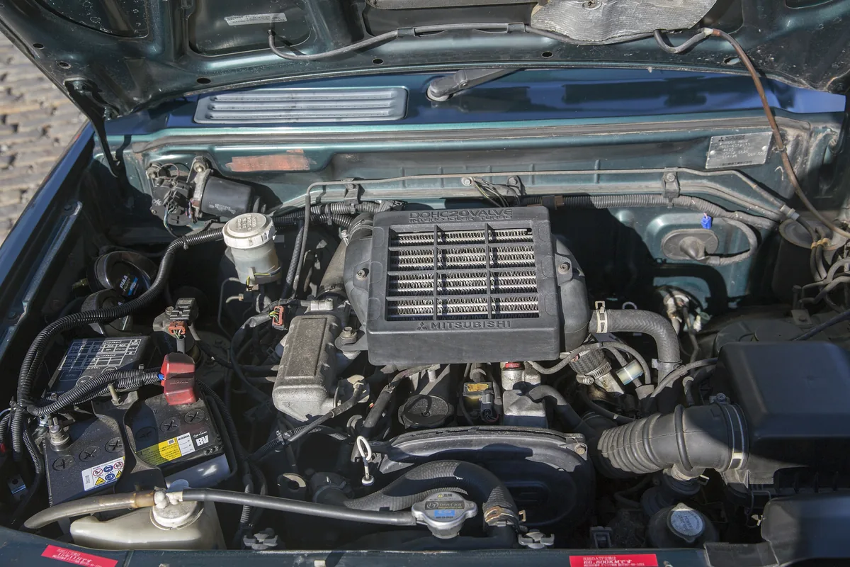 The 659 cc 4A30 20-valve turbo engine in a 1995 Mitsubishi Pajero Mini, with its top-mounted intercooler