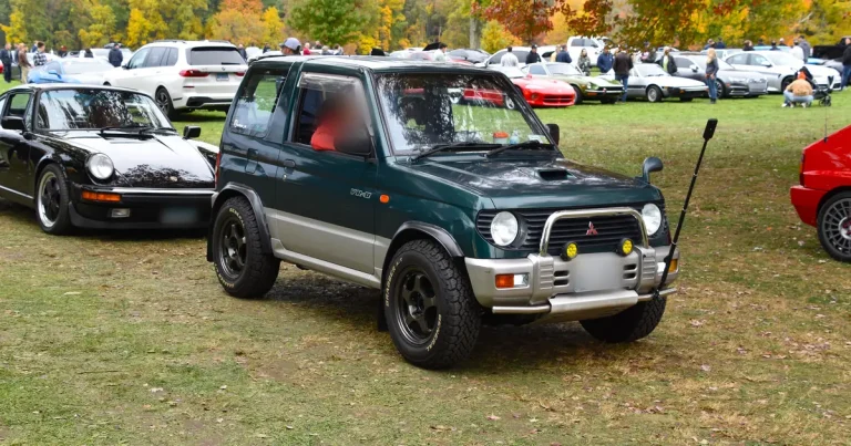 Green 1995 Mitsubishi Pajero Mini VR-II Turbo 4x4 parked on grass at a car show