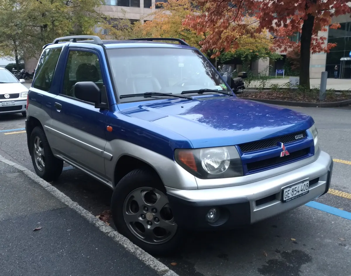 Blue and silver Mitsubishi Pajero Pinin three-door